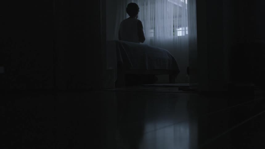 A person sitting on a bed