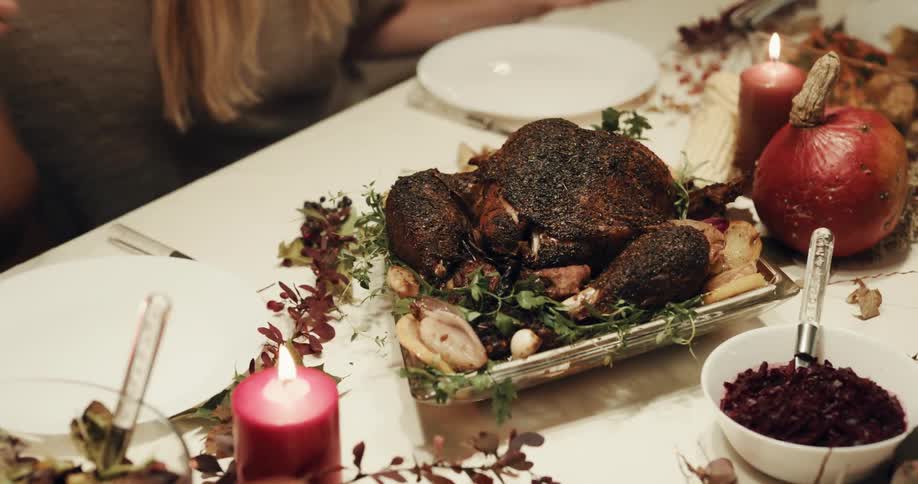 Person putting turkey on table