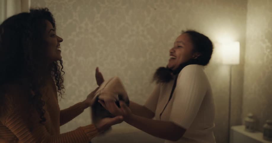 Group of happy friends greet each other in the living room at home