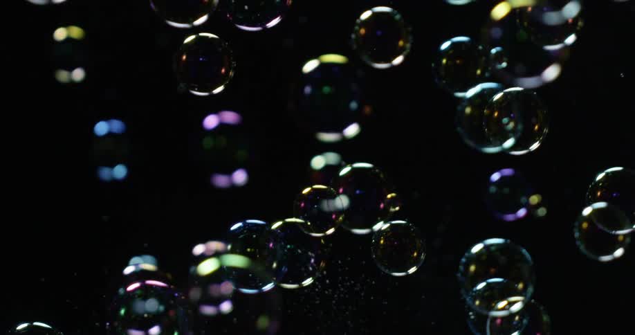 Bubbles float around in a black area