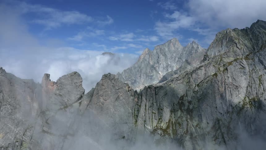 Mountain ridge high in the clouds