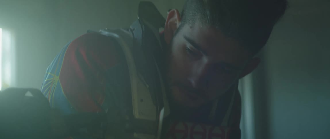 A man sitting in a room thinking