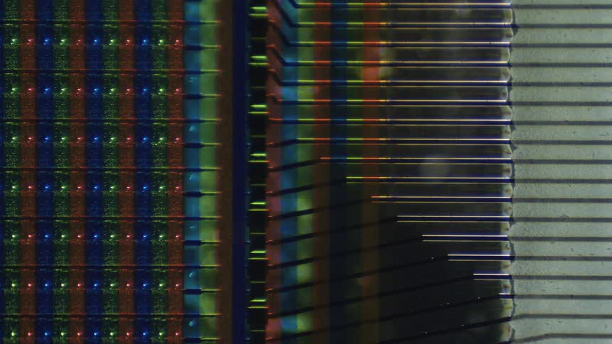 A colorful textured surface blurring and coming into focus