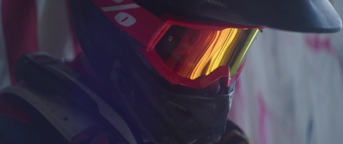 A person is wearing a motorcyle helmet and goggles