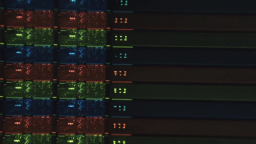 A close up of a machine is lit up in different colors