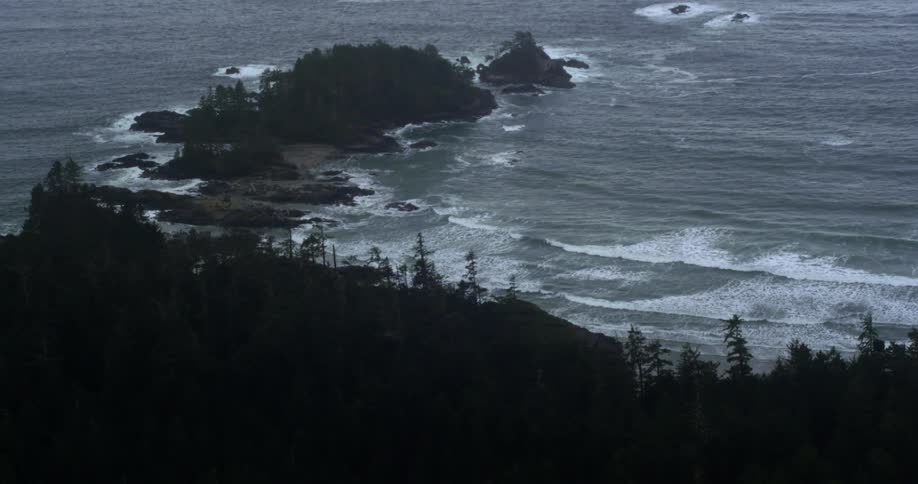 The waves crash against the shore