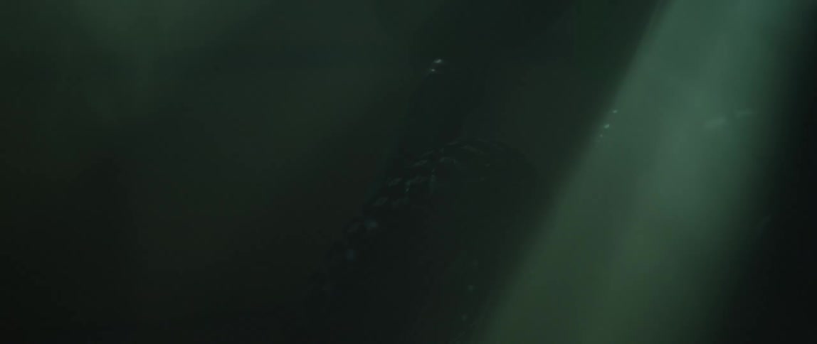 Light rays shine into room where bike sits in the dark