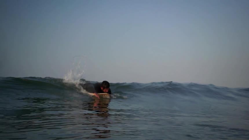 Guy Surfing On Coast