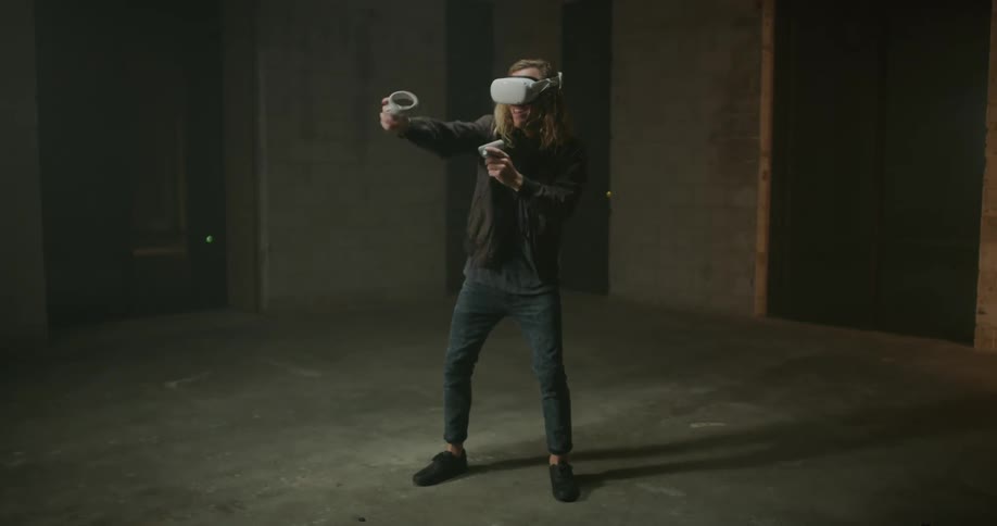 A man is using a virtual reality headset