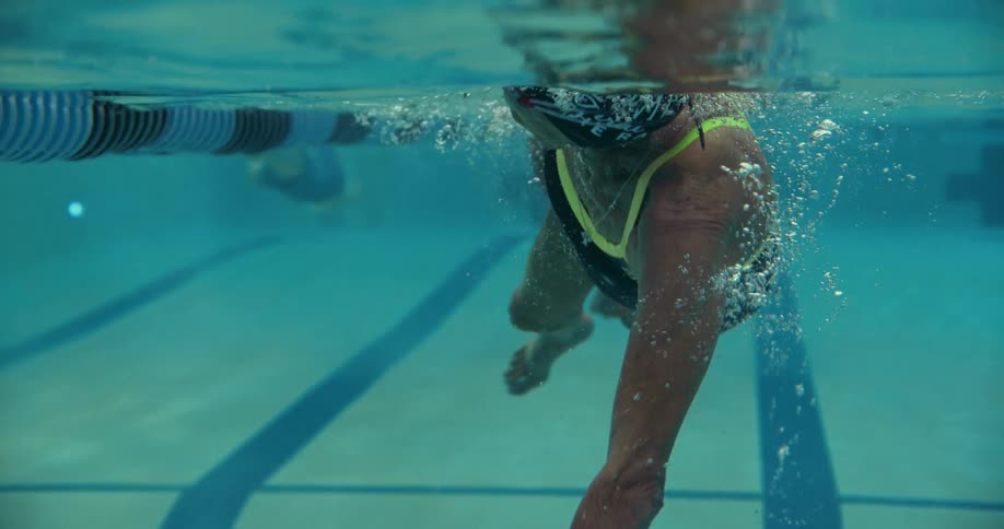 A view of a person swimming in a pool