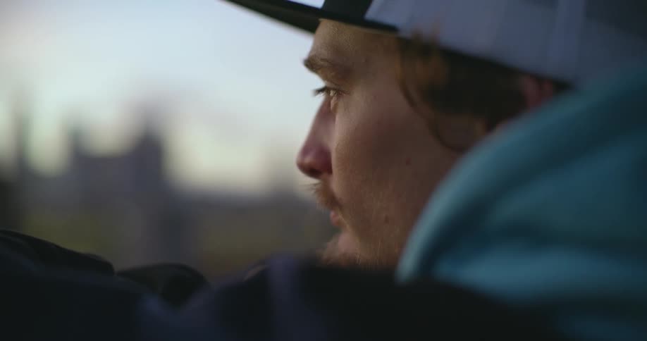 A man is looking around outside