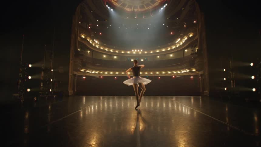 A ballerina dances on a stage