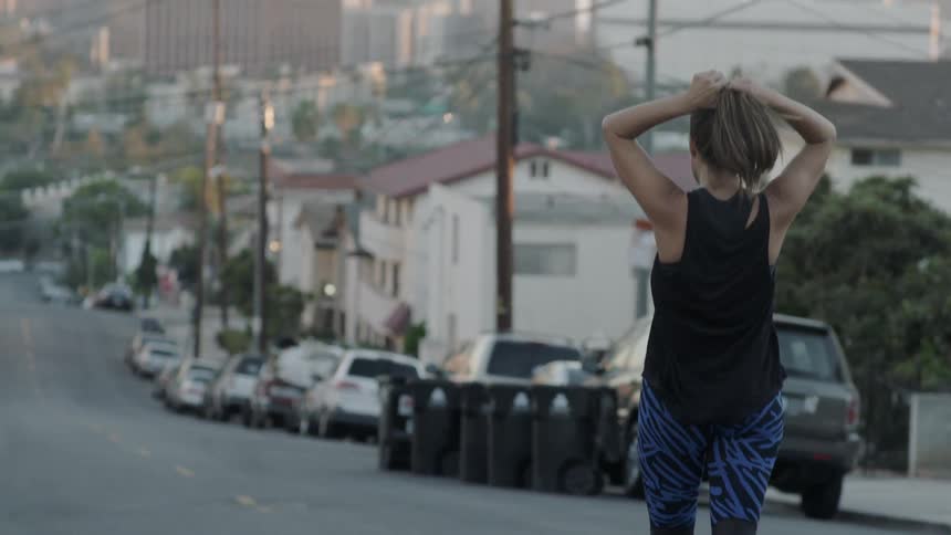 A woman walks down a street