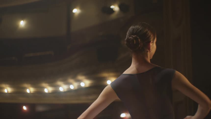 A ballerina is performing on the stage