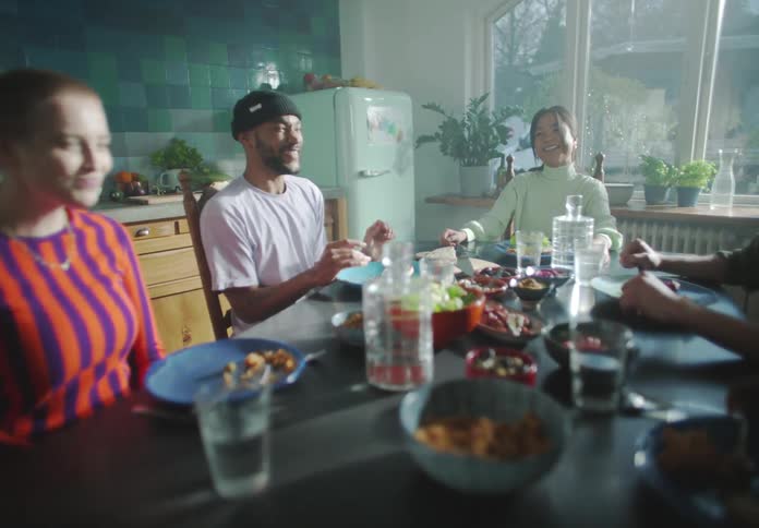 A group of people are having dinner together