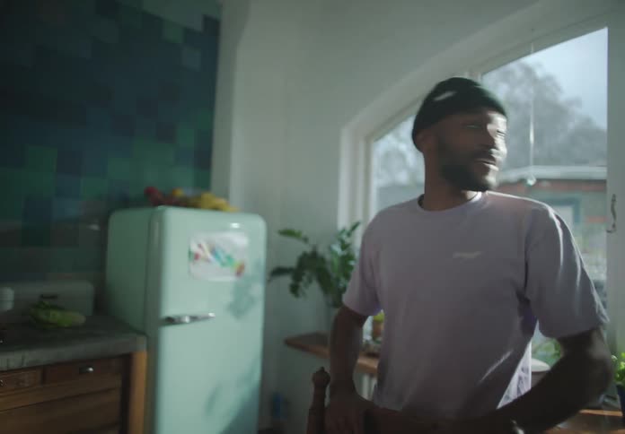 A man standing in a room talking