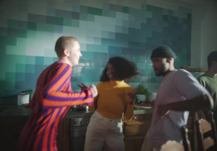 Group of people dancing in kitchen