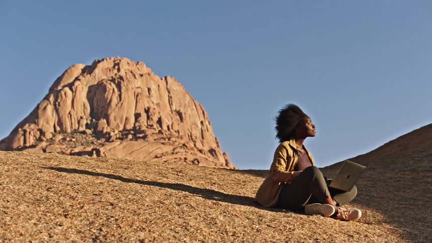 Black female sitting down