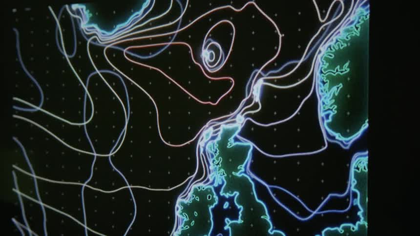 A display shows some coastlines with waving lines all round