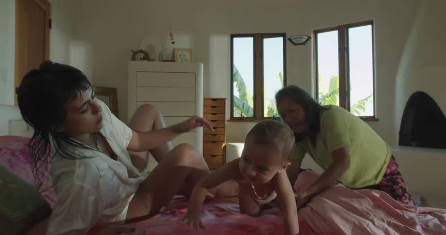 A child is crawling on the bed