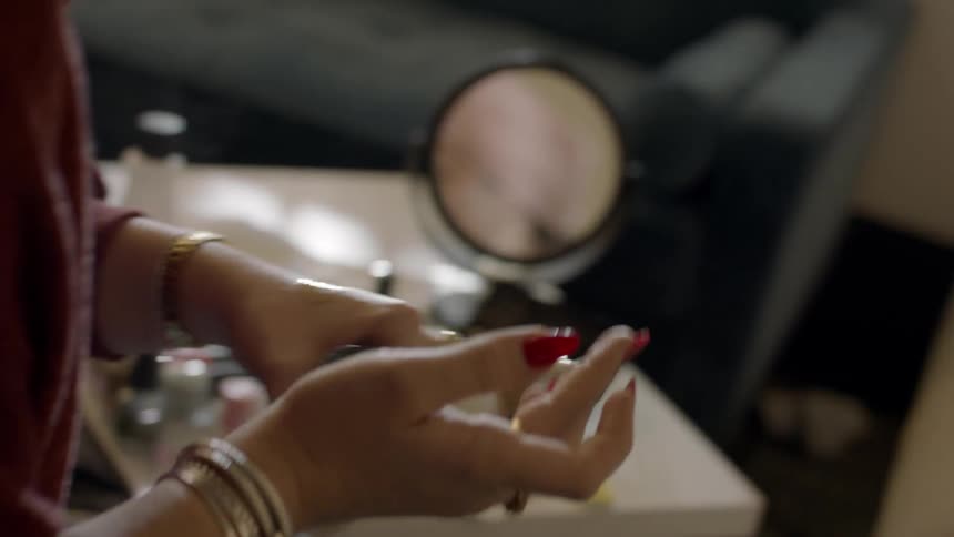 A person is putting makeup on a lady