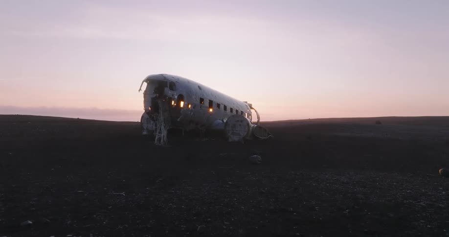 A broken down plane is crashed on the ground
