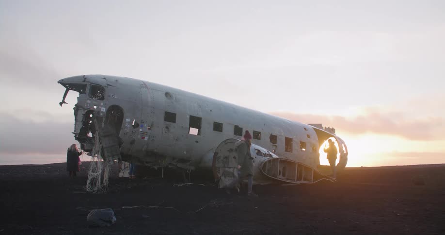 People tour around a plane crash