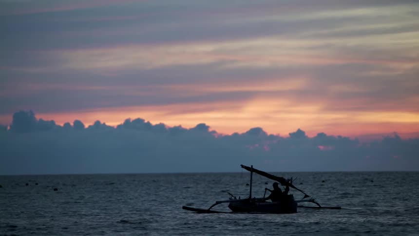A boat sailing on the morning