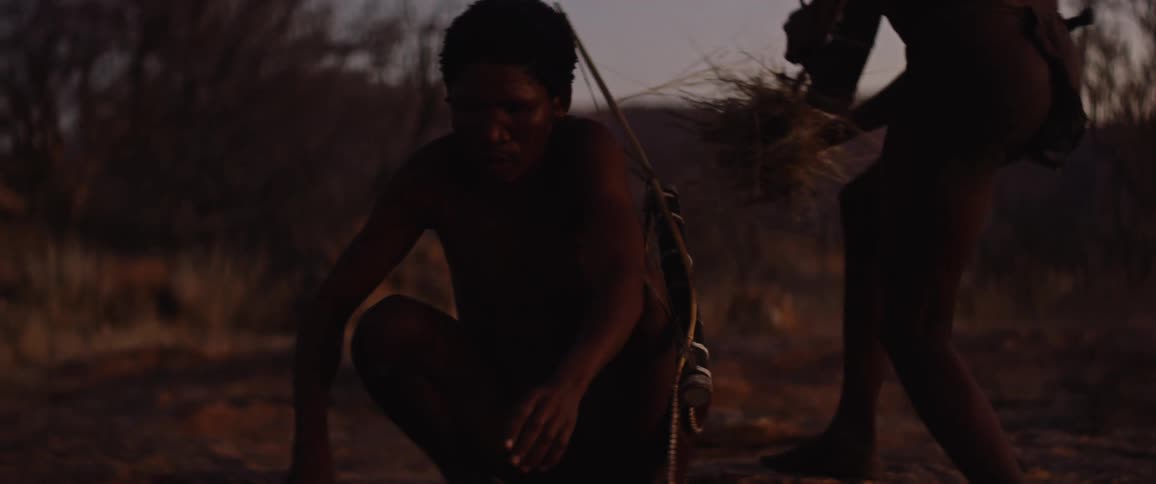 Two hunters starting a fire