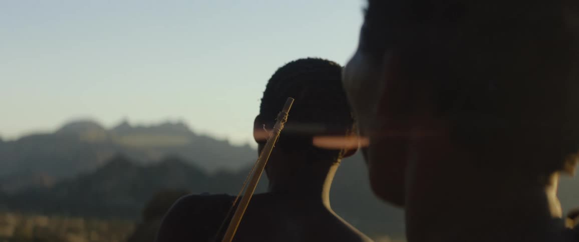 Tribal men on a hunt at dusk