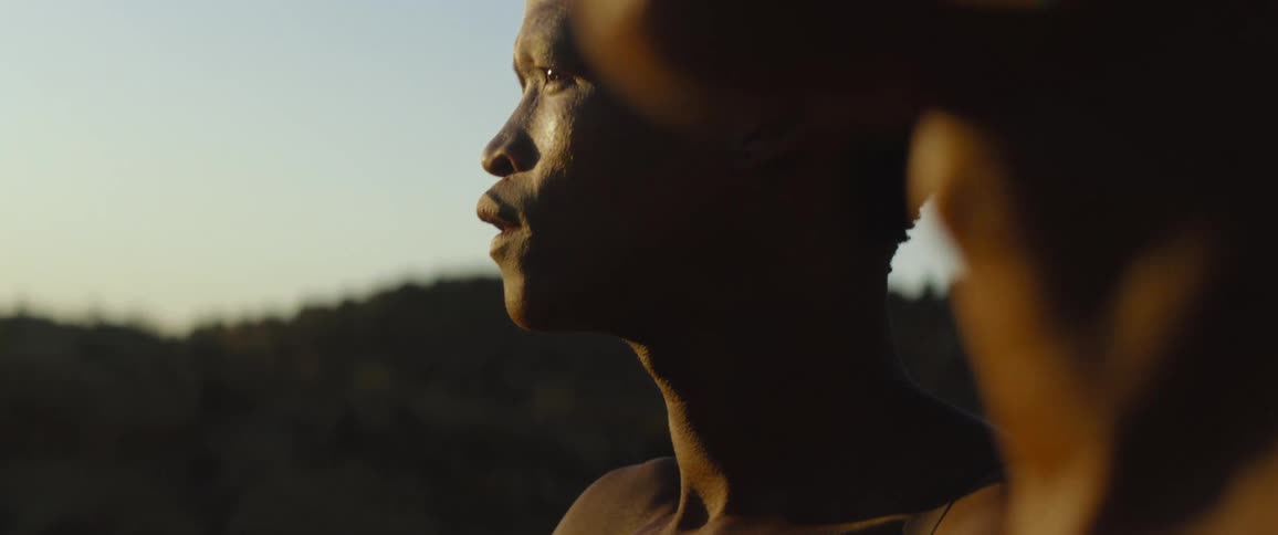 Tribal men looking at a sunset