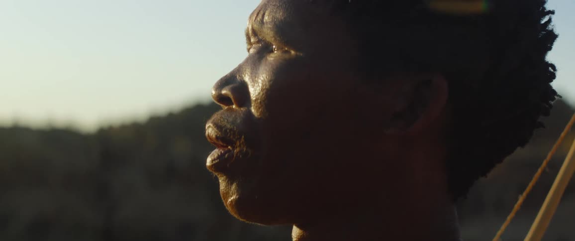 Tribal man looking at the sunset