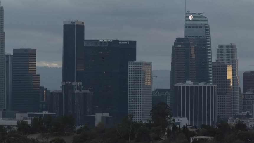 Aerial view of a downtown city is displayed at dusk
