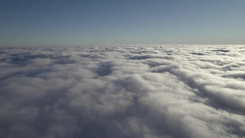 Aerial view flying above the clouds