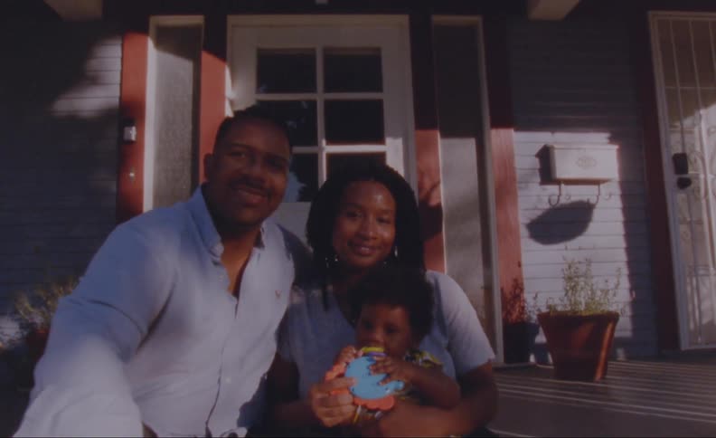 A family is sitting outdoors in spring