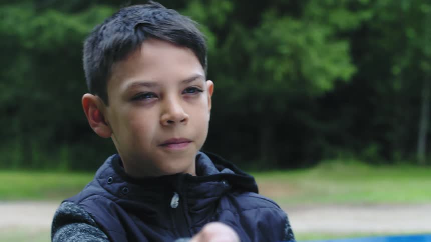 A child is playing outdoors in spring