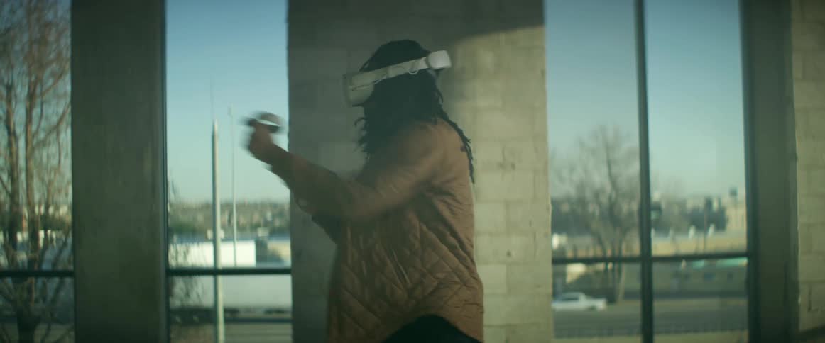 A man is playing virtual reality indoors