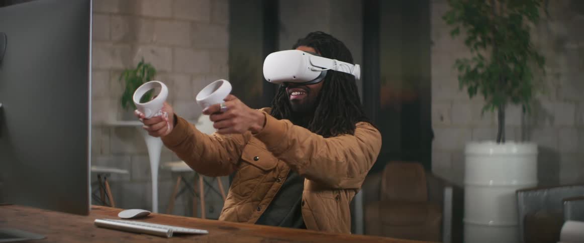 A man that is playing games in a virtual reality environment