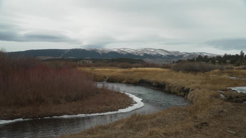 The stream runs through the valley