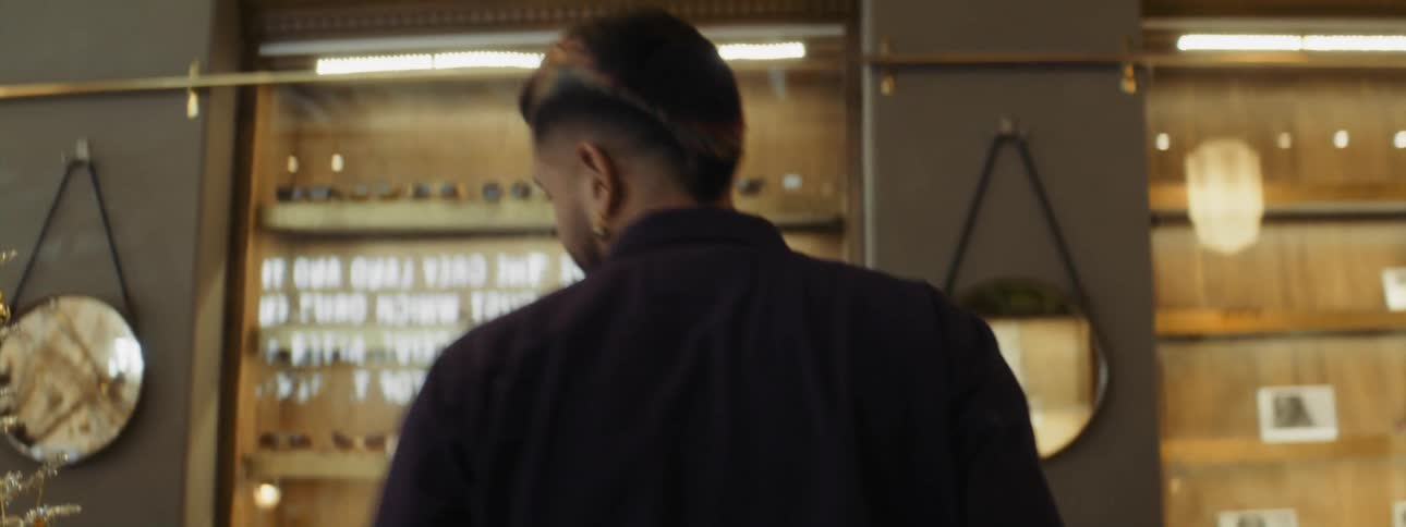 An employee is walking around a store
