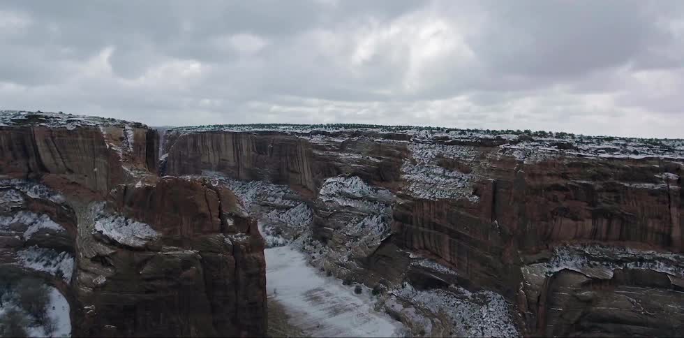 A light dusting of snow covers a canyon