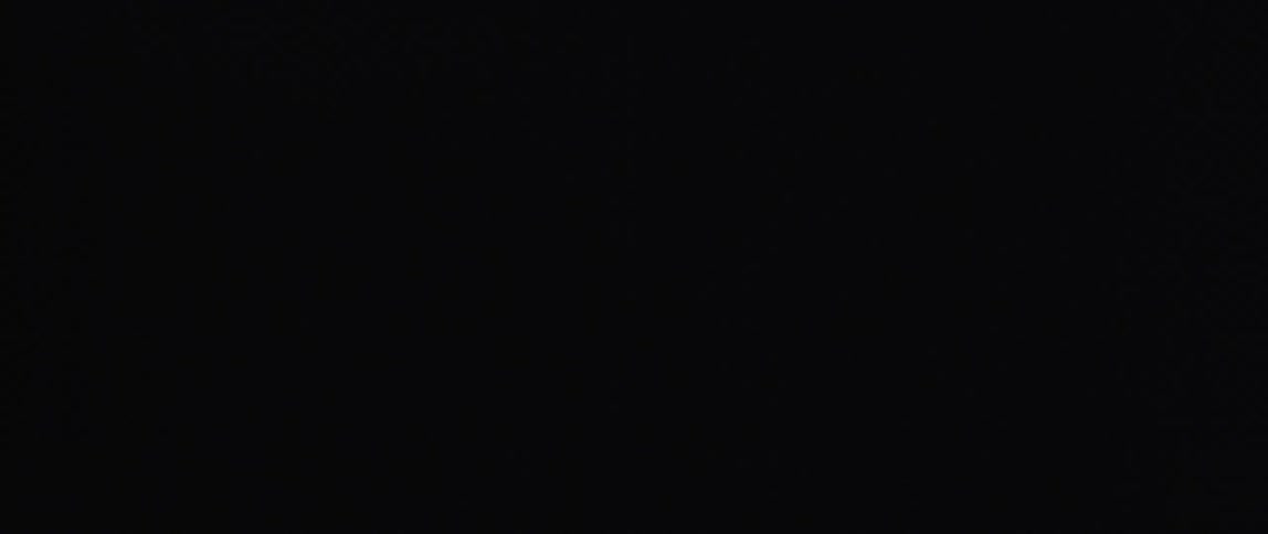 Lights flash in a dark grass filled area