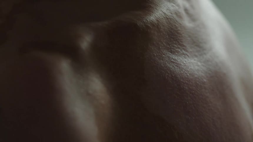 A person is shirtless in the room