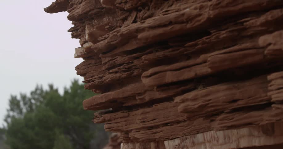 A rock formation near a forest