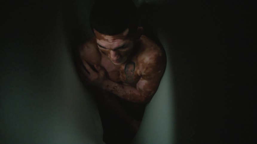 A man is scared as the walls move around him