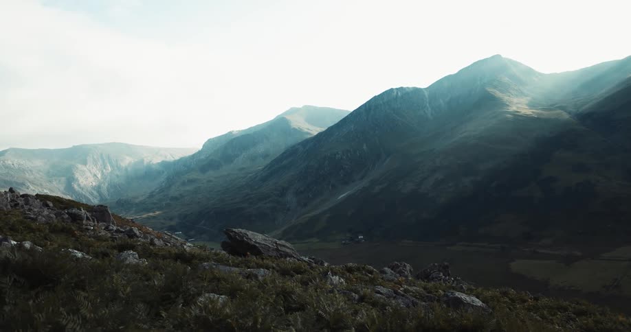 A mountain slope covered in rocks and boulders during the day