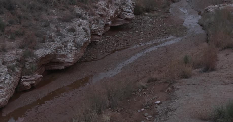 A stream of water flows down a hillside
