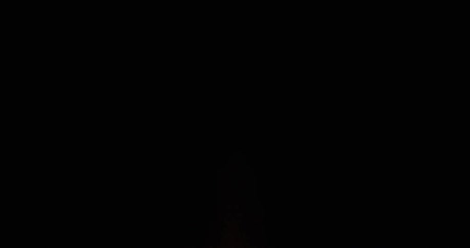 A fire sparking against a dark night