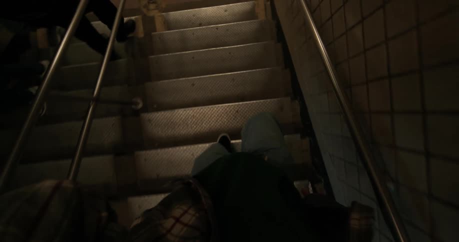 A person is walking down the stairs