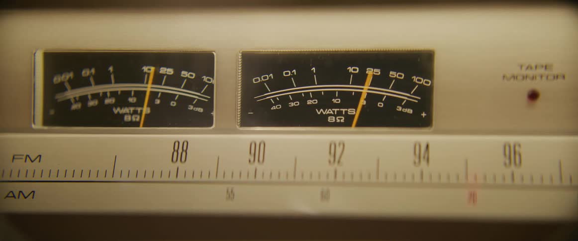 Needles indicate watts on am fm radio and tape player